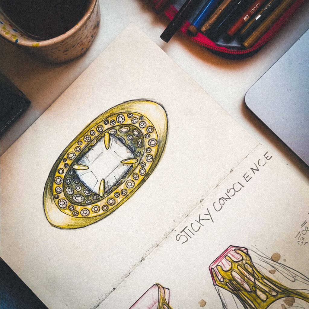 Designing the jewellery on paper, hand made drawings by the artist.