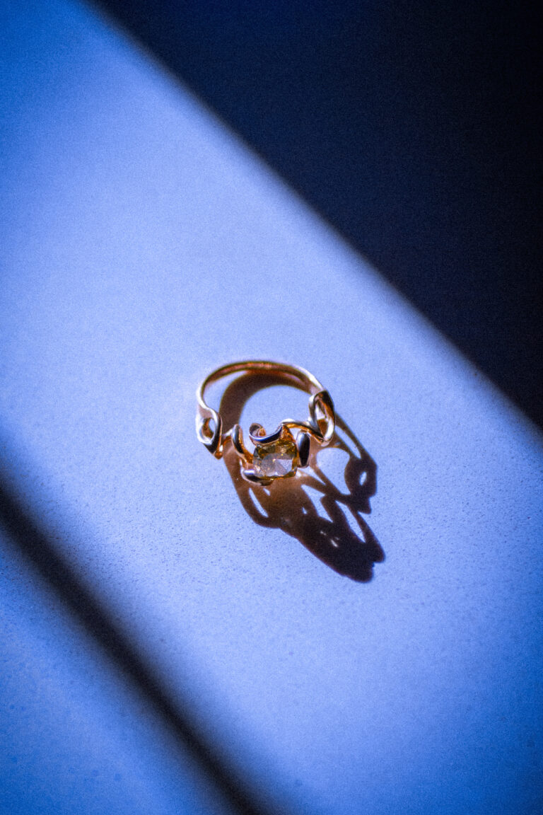 Liqua ring set with a 2 carat yellow diamond.