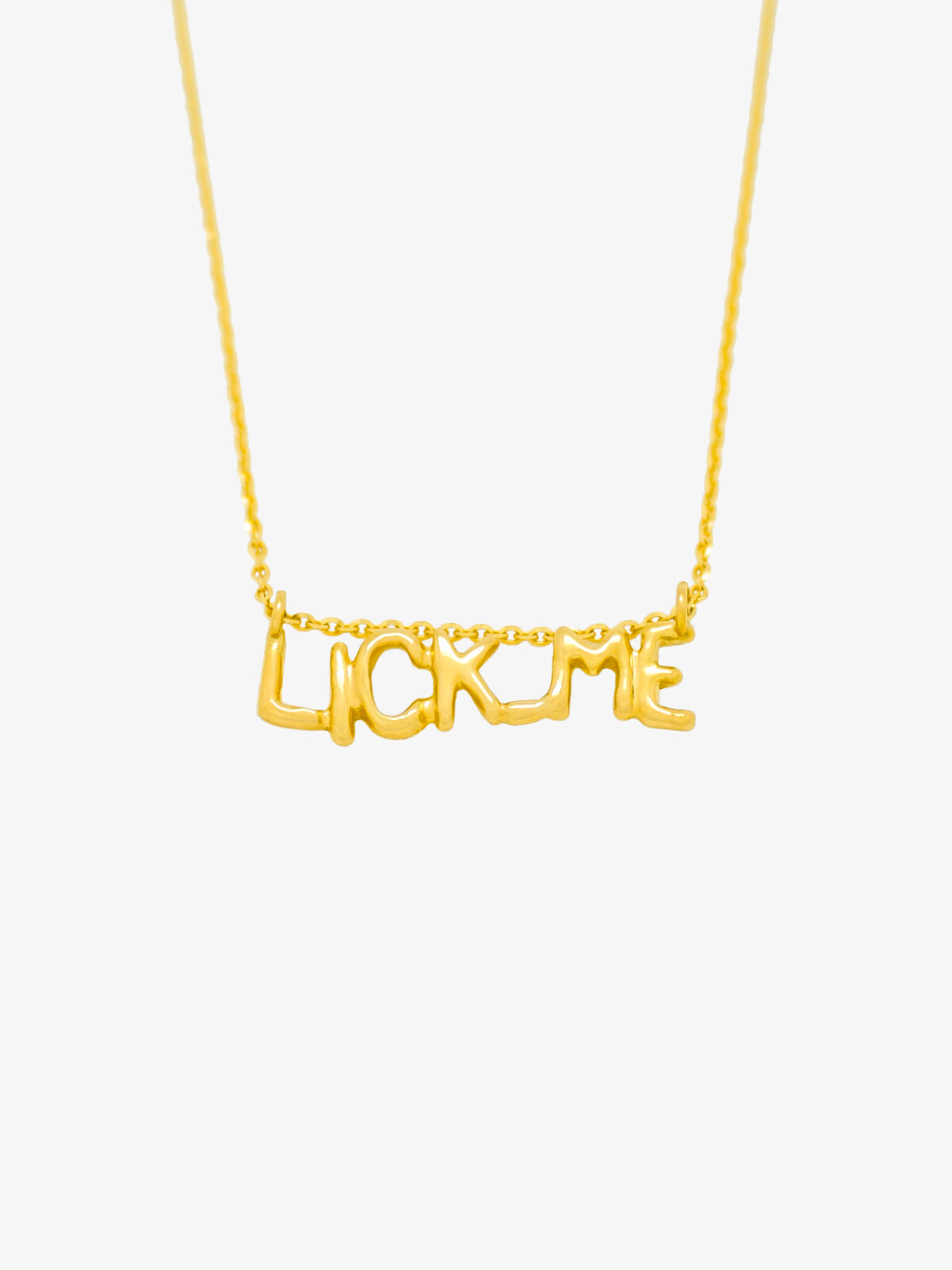 18 K Gold Lettering Pendant Necklace LICK ME in yellow • LAURE VICTORIA GAURY HIGH JEWELLERY Photography of the 18 K Gold Lettering Pendant Necklace LICK ME in yellow gold.