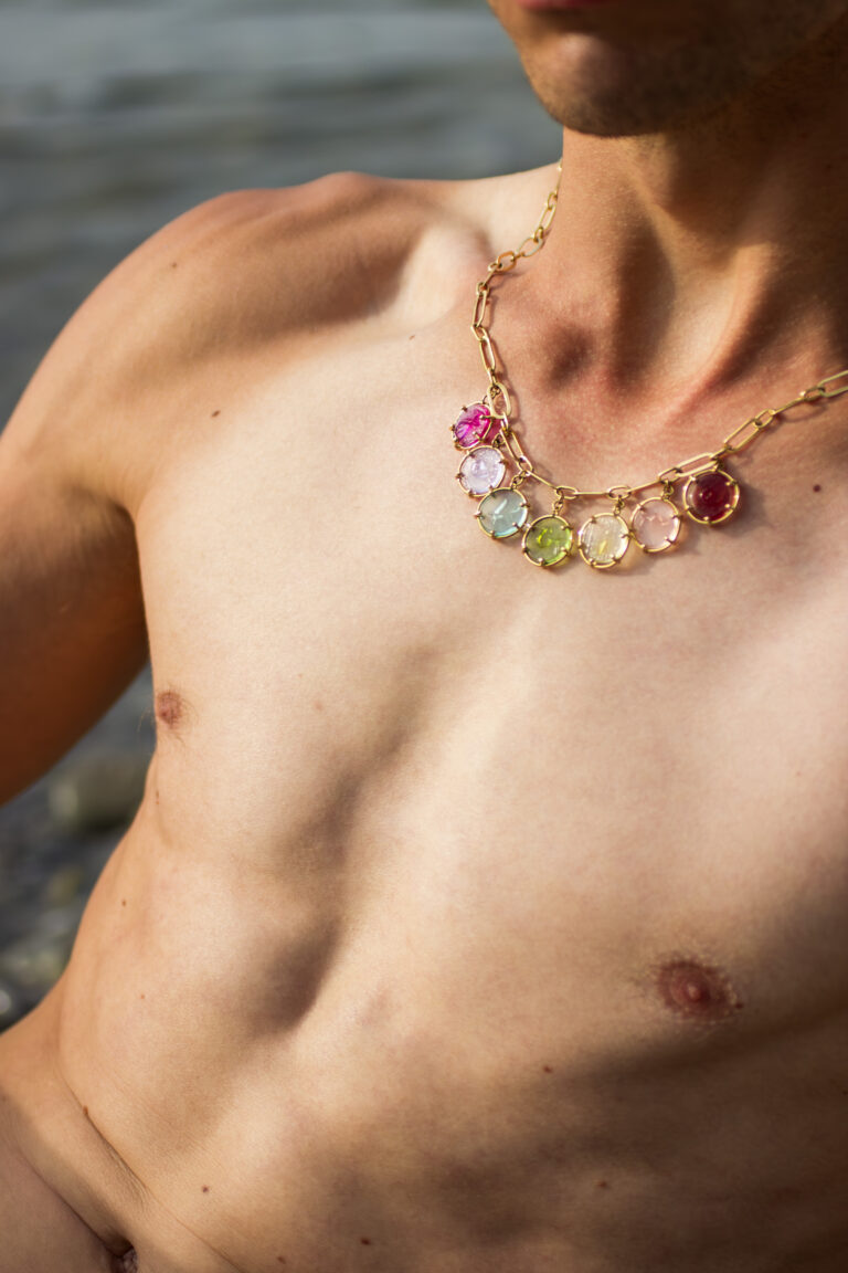 Model wearing the je t'aime necklace in 18 carat gold.