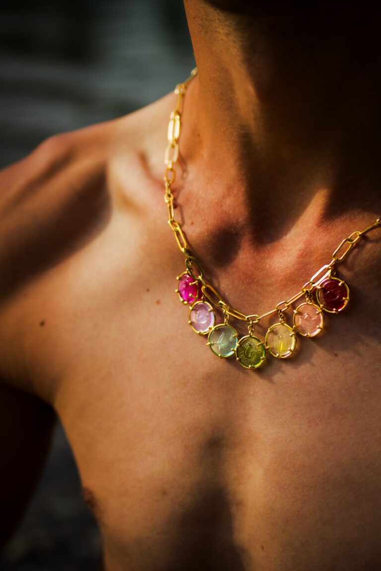 18 Carat Yellow Gold Necklace wih signature claps on shirtless model.
