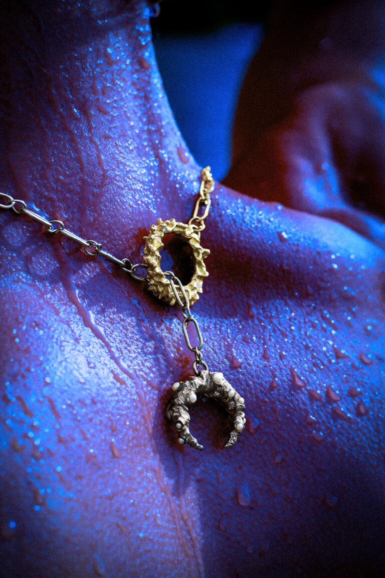 Stardust necklace worn by model, 18 carat gold diamonds and pearls.