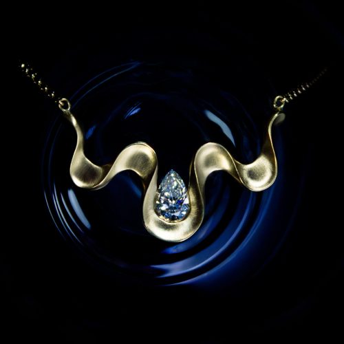 Final piece of the bespoke diamond pendant in 18 carat gold.