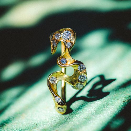 solar earring in 18 carat gold with diamonds