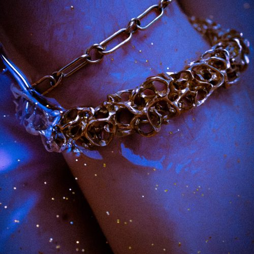 Solar bracelet in water worn by a model.